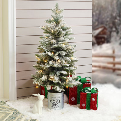 Snow-flocked Lighted Christmas Tree