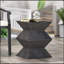 Table d'appoint d'extérieur en béton léger avec design géométrique et fonctionnalité portable