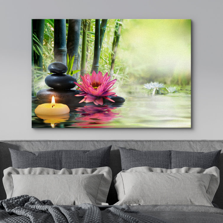 Zen Stones Rocks and a Lotus on a Lake Next to Bamboo Branches - Wrapped Canvas Print