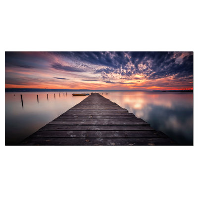 Photographie sur toile tendue - Coucher de soleil coloré sur un lac