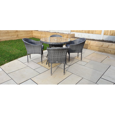 Lilia 4 - Person Wicker Patio Dining Set with Round Table , Cushions Included
