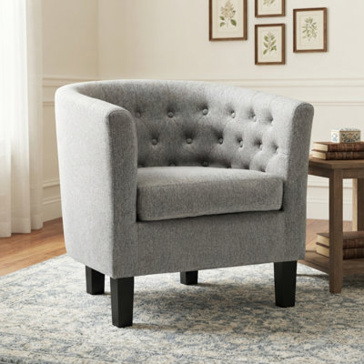 Fauteuil demi-tonneau capitonné avec pieds en bois
