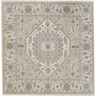 Tapis rose et ivoire de haute qualité noué à la main