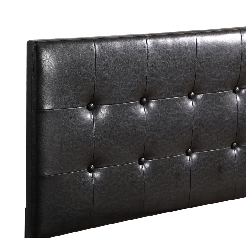 Lit simple noir avec une touche contemporaine - rembourrage en mousse pour une bonne nuit de repos