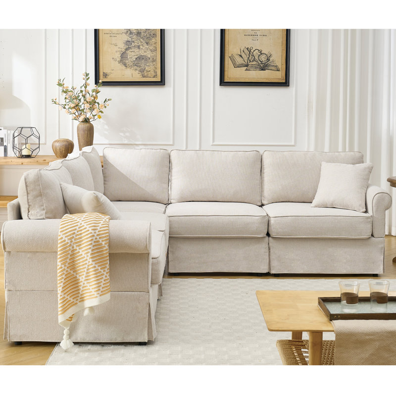Canapé modulaire convertible de 5 places en forme de L beige recouvert de tissu doux et de fabrication en forme de canapé, coussins réversibles à accoudoirs roulés mi-moelleux