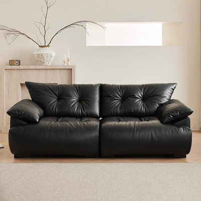 Canapé modulaire noir en similicuir
