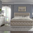 Tysheena Queen Upholstered Sleigh Bed, Dresser & Mirror