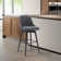 Orfield Modern Swivel Counter or Bar Height Upholstered Armless Bar Stool with Footrest in Wood