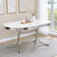 Table de salle à manger blanche et chrome ovale