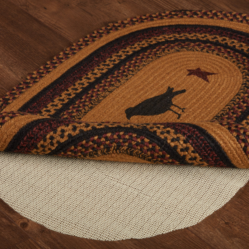 Oval Braided Jute Rug with Crow Design in Black and Mustard