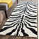 Schell Animal Print Wool Area Rug