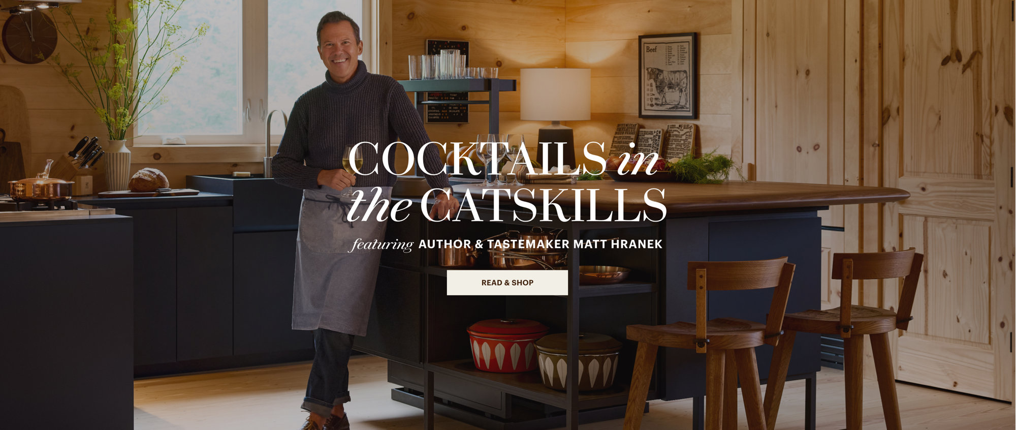 Author and tastemaker Matt Hranek in a rustic kitchen for Cocktails in the Catskills, with a button to Read & Shop.