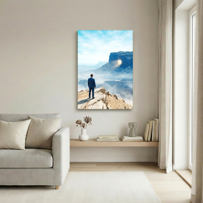 Man in Blue Suit Viewing Glowing Portal on Rocky Mesa Canvas Wall Art
