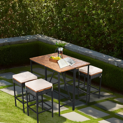 Shayli 4 - Person Acacia Wicker Patio Dining Set with Extendable Rectangular Table , Cushions Included