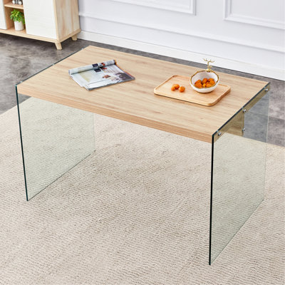 Le dessus de la table basse est fait de panneaux de fibres à densité moyenne et d'autocollants en bois, avec du verre trempé transparent des deux côtés. Le design est simple et élégant, avec une structure robuste.