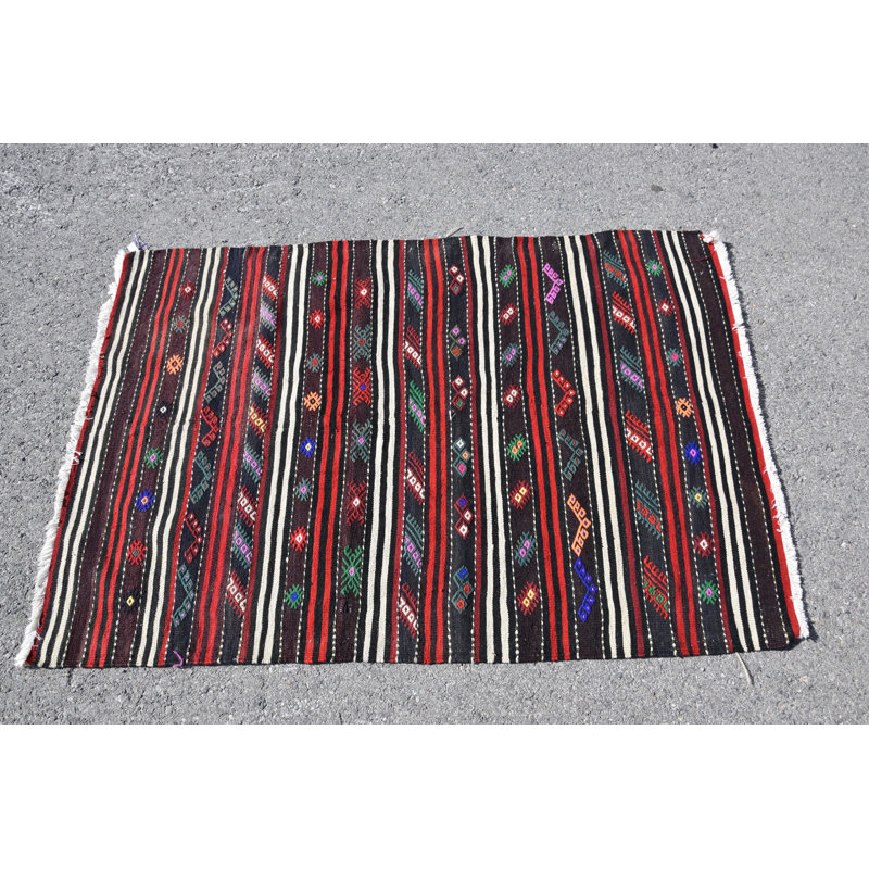 Tapis traditionnel turc en laine avec des rayures géométriques complexes multicolores pour un décor bohème