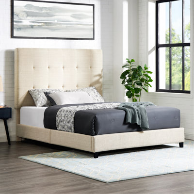 Grand lit plateforme tapissier capitonné beige