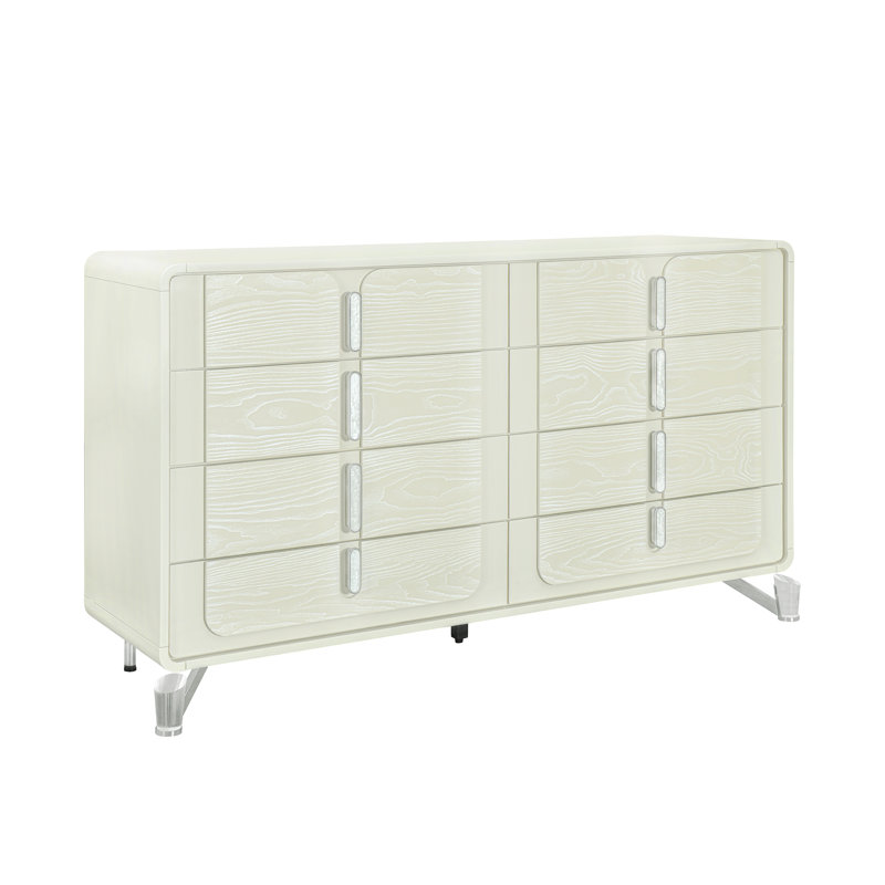 La commode et la commode avec une finition en bois clair et des poignées encastrées combinent un style minimaliste avec un rangement de chambre peu encombrant