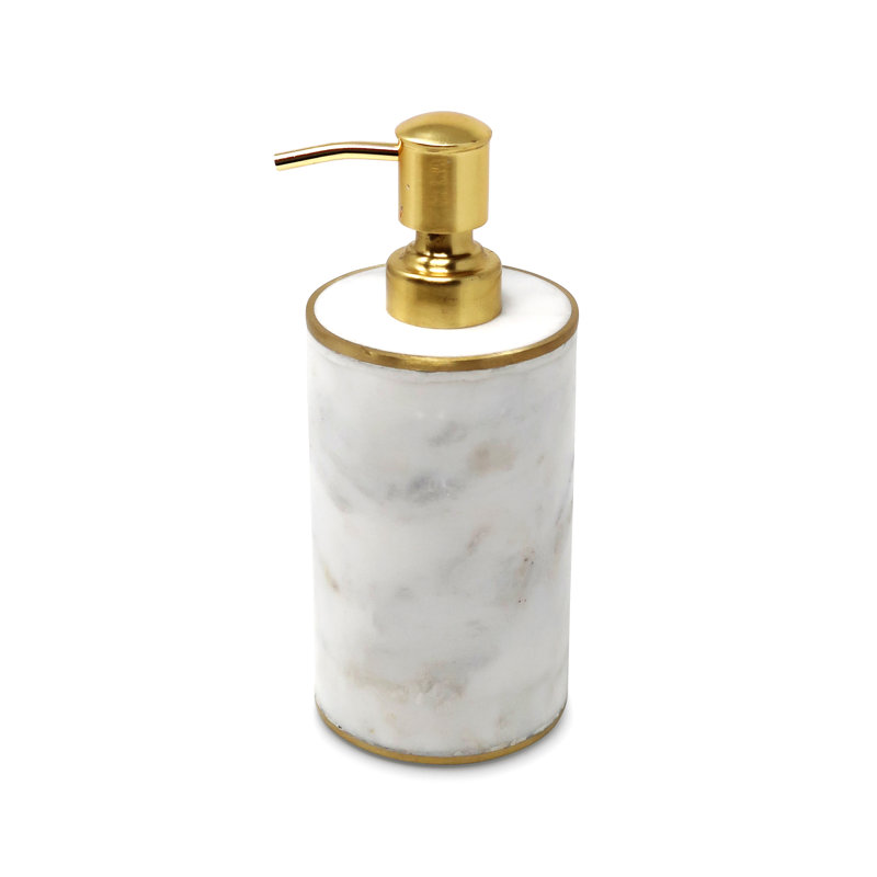 Distributeur en marbre blanc avec pompe dorée
