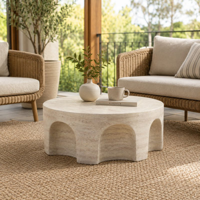 Table basse ronde avec base arquée