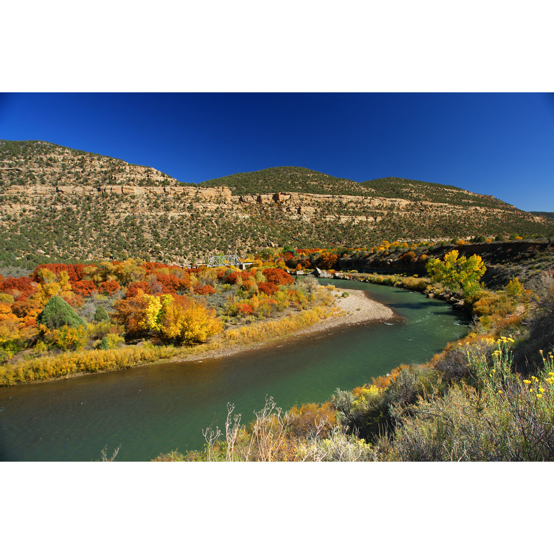 River Bend Autumn Trees And Mesa Landscape von Amygdala_imagery - No Frame Print on Canvas