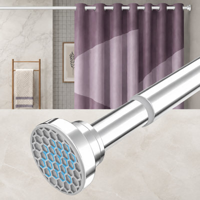 This silver heavy-duty spring-tension shower curtain rod adjusts from 30-74 inch with a 7/8" diameter; made from 304 stainless steel, it is designed to never rust, provides a non-slip hold, and installs without drilling for bathrooms and kitchens.