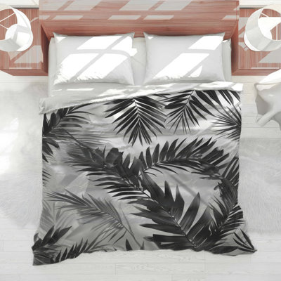 Édredon noir avec feuilles de palmier