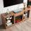 Meuble télé moderne avec foyer électrique, lumières DEL et charge USB, combinant divertissement et chauffage pour un salon élégant