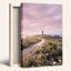 Art mural sur toile, "Phare sur une falaise avec chemin sinueux et ciel rose"-133521591
