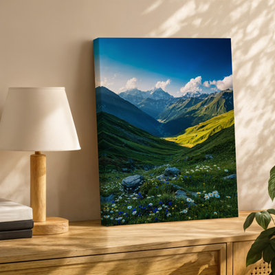 Canvas A Breathtaking Panoramic Landscape Featuring A Lush Green Valley Surrounded Wall Art By Majestic Snow Capped Mountains Bathed Canvas Wall Art