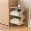 Table d'appoint roulante ondulée 22,4 po, table de bout autoportante en ABS avec roulettes