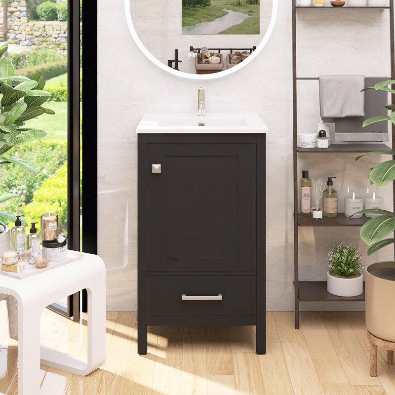 Meuble-lavabo gain de place avec lavabo en céramique, tiroirs à fermeture douce, organisateur de porte, tiroir séparateur et pieds en plastique réglables.