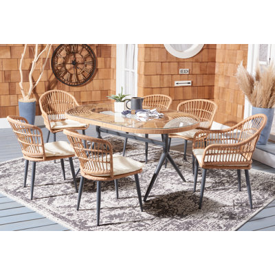 Andice 6 - Person Wicker Patio Dining Set with Oval Table , Cushions Included
