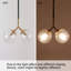 Luminaire suspendu sphère 2 lumières noir et or avec abat-jour en verre bullé