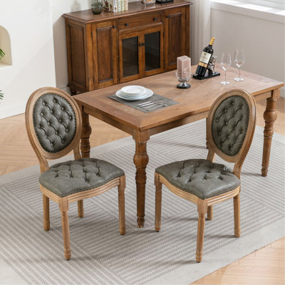 Chaise de salle à manger en similicuir en similicuir avec boucle à la main et garniture cloutée