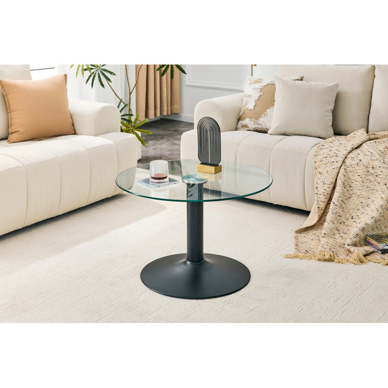 Table basse ronde en verre trempé de 27,5 pouces de diamètre. 17,7 pouces de haut, soutenu par une base en métal noir, avec un bord de luxe léger.