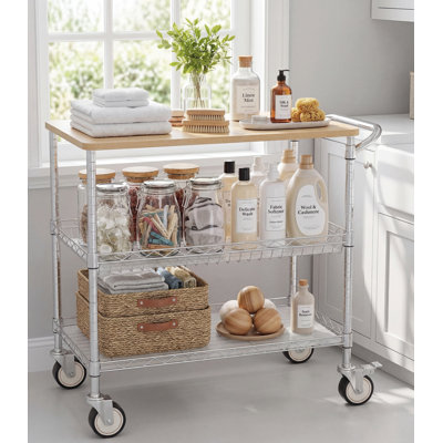 Chrome-Plated, Three-Tiered, Wheeled Kitchen Cart With A Wooden Countertop, Handles, And Padded Shelves. Dimensions: 34.77 X 17.7 Inches. Heavy-Duty Multi-Purpose.