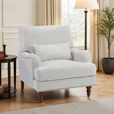Upholstered Beige Nailhead Trim Accent Chair with Throw Pillow and Solid Wood Legs