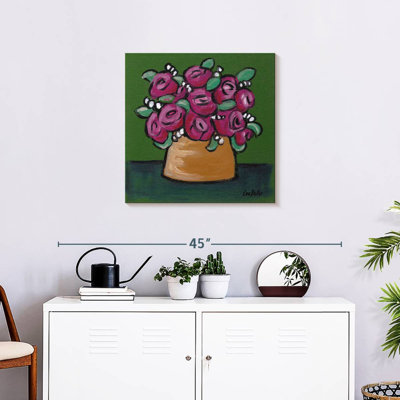 Fleurs en pot rose sur vert
