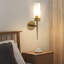 Lampe murale dorée avec abat-jour en verre transparent Ilgar