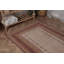 Un élégant tapis turc rétro avec des motifs floraux beiges pour un style bohémien