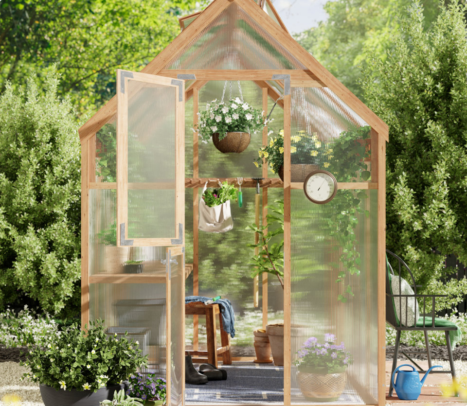 Greenhouse with plants and garden tools inside.