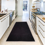 Halstad Tufted Black Area Rug