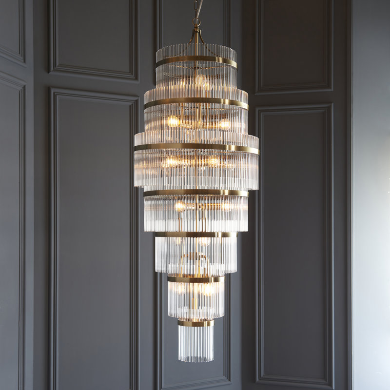 Geira Grand 21lt Tiered Pendant light finished in Ant. Brass