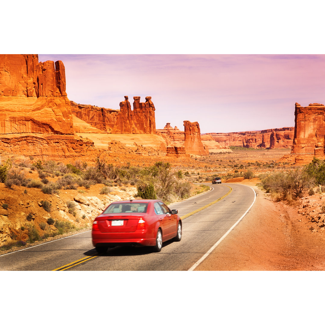 Autofahren, Road Trip Touring At Arches National Park, Utah von YinYang - No Frame Print on Canvas