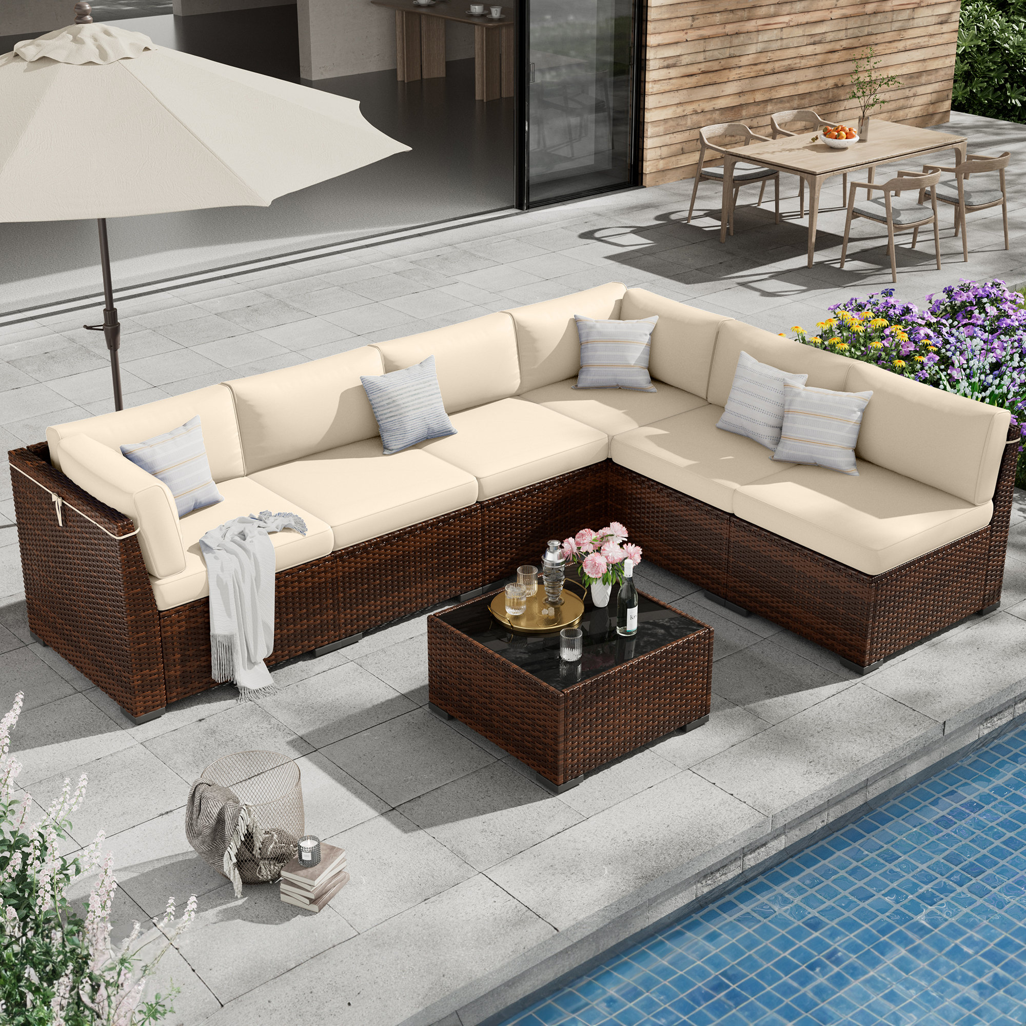 Ebern Designs 7 Piece Rattan Sectional Seating Group with Cushions