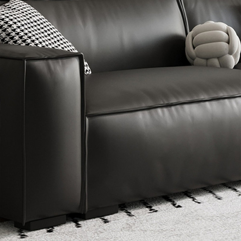 Causeuse-coussin modulable noire en cuir véritable