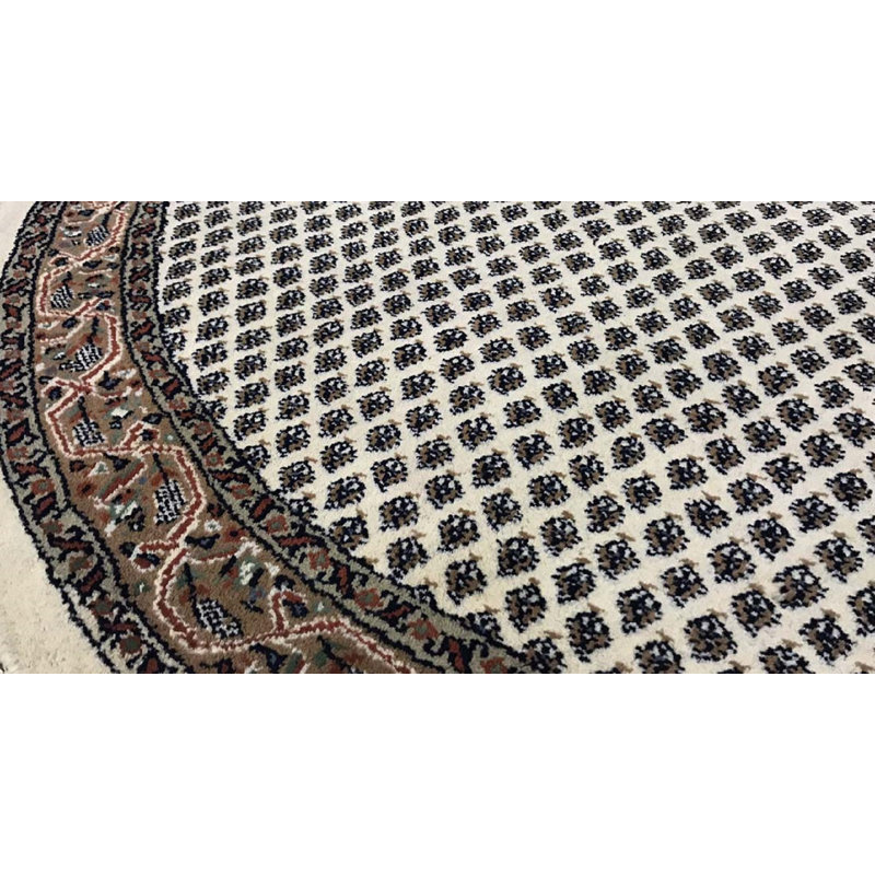 Tapis rond crème de haute qualité noué à la main