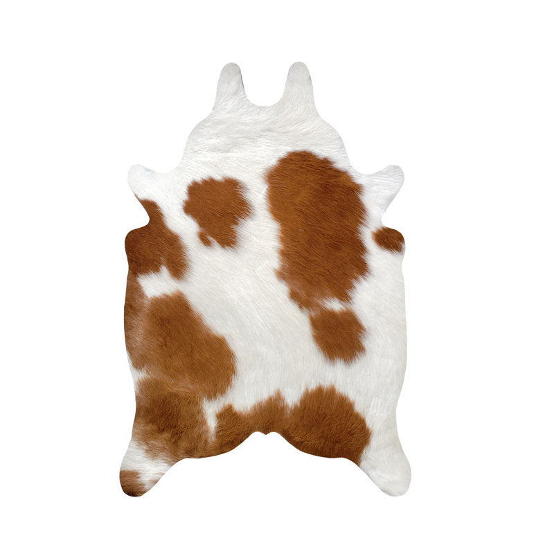 Tapis brun et blanc en cuir de vache