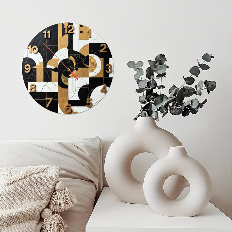 Horloge murale abstraite dorée et noire